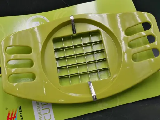 [22215] Potato cutter with perforated handles